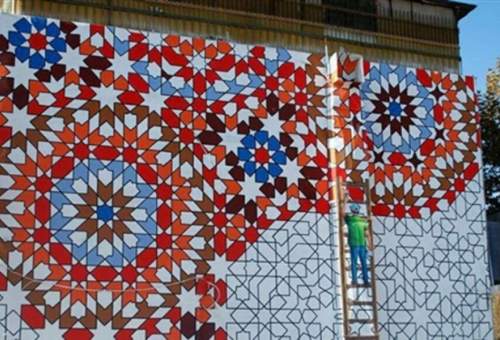 اجرای هزار و ۹۰۰ متر مربع نقاشی دیواری نوروزی در ورودی‌های شهر